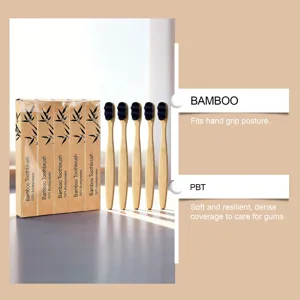 Brosse à dents en bambou écologique avec poils noirs souples et prise en main agréable.