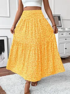 Yellow floral tiered midi skirt detail showing beautiful pleated waist and cute print.