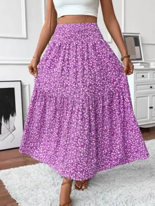 Detail view of the purple floral tiered maxi skirt, showing the beautiful fabric and pleats.