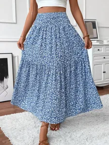 Blue floral tiered maxi skirt featuring high waist and comfortable smocked design detail.