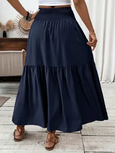 Detailed view of elegant women's navy blue high-waist tiered maxi skirt, back perspective.