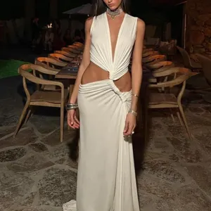 White sleeveless deep V-neck cutout maxi dress detail showcasing elegant gathered knot design.
