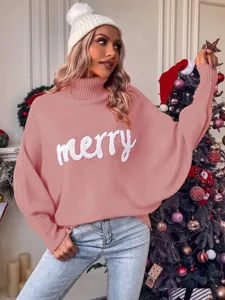 Cozy pink turtleneck sweater featuring relaxed batwing sleeves and charming merry knit text for winter.