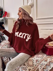 Close-up shot of the cozy red knit turtleneck sweater featuring festive merry text design.