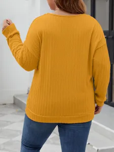 Back detail of a stylish solid yellow cable knit sweater, loose fit long sleeve top.
