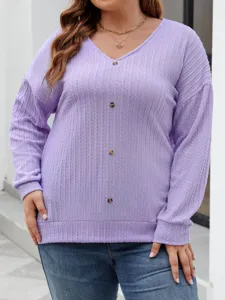 Close-up detail of a women's purple V-neck knitted sweater with front buttons and long sleeves.