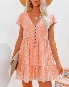 Detailed view of the floral V-neck mini dress showing front buttons and tiered hemline.