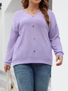 Close-up detail of a light purple V-neck knit sweater with buttons and long sleeves.