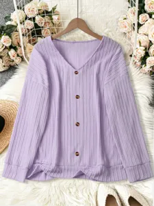 Detailed view of the light purple V-neck knit cardigan with brown buttons and fine ribbed texture.