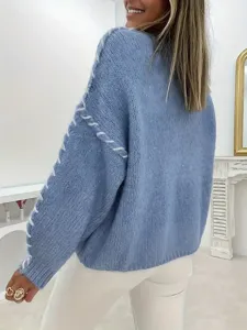 Back view detail of casual light blue knitted pullover sweater with white lace-up details.