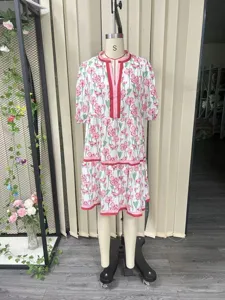 Detailed view of the floral print tiered dress, featuring a V-neckline and elegant retro style.