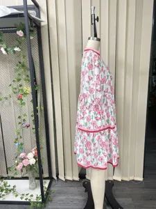 Detailed side view of a women's floral print loose long dress with layered tiered hem.