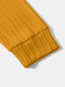 Mustard yellow vertical stripe knitted sweater sleeve cuff detail, soft fabric texture.