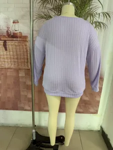 Back detail of solid color vertical stripe knit sweater in light purple color. Perfect texture.