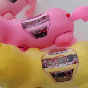 Close-up detail of electronic walking puppy toy with transparent glowing gear compartment.