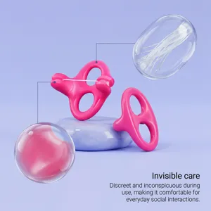 Detailed view of the ergonomic hands-free dental flosser showing fine floss threads and smooth pink finish.