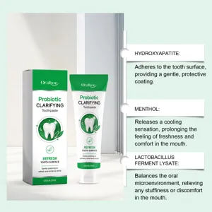 Detail view of Oralhoe probiotic clarifying toothpaste tube and box with key ingredient callouts.