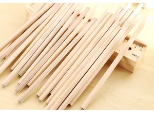 Raw wood hexagonal pencils detail shot, natural wood stationery for sketching and drawing
