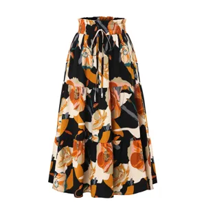 Elegant floral print tiered maxi skirt with elastic waist and drawstring for women.