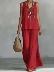 Casual bohemian red V-neck vest and wide-leg pants set detail showing elegant drape and fabric.