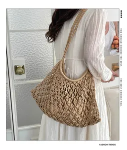 Detailed view of hand-woven beige macrame tote bag for beach and casual summer wear