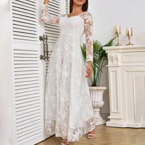 Stunning white lace long sleeve maxi dress detail, elegant wedding gown scene display.