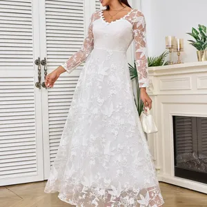 Detailed view of the elegant white long sleeve lace maxi wedding dress with exquisite floral embr.