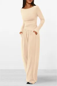 Detailed view of beige long sleeve top and wide leg pants casual lounge set fabric