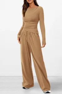 Casual two-piece lounge set featuring long sleeve asymmetric top and wide leg pants.