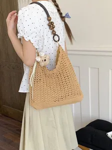 Handmade woven hollow crochet shoulder bag with wooden bead strap and bear charm