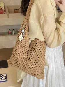 Handmade hollow-out knitted tote bag for women's summer beach vacation and daily use.