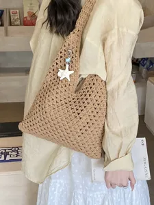 Hand-woven hollow-out tote bag with starfish pendant for summer beach trips