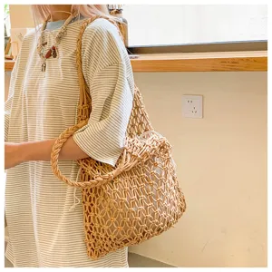 Detailed view of a handmade cotton rope woven tote bag featuring a drawstring inner pouch