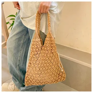 Detailed view of a handmade cotton rope woven tote bag with a white drawstring liner.