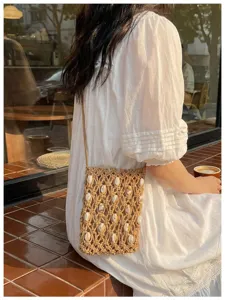 Woven shell crossbody phone bag for beach holiday with bohemian summer vacation vibe