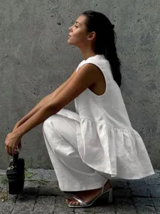 White cotton sleeveless top and pants set for women, chic minimalist commuter two-piece outfit.