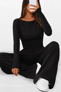 Detailed view of the black long sleeve top and wide leg pants casual lounge set.