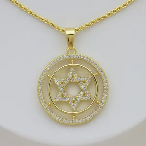 Close-up of a 18k gold-plated Star of David pendant necklace with zircon inlay
