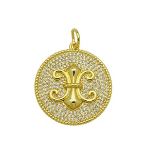Detailed view of gold-plated Fleur-de-lis round pendant with cubic zirconia