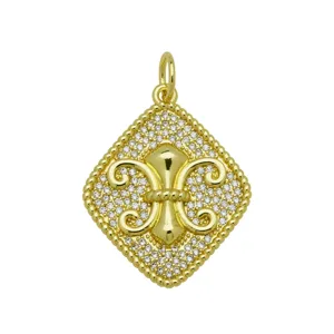 Detail view of 18k gold plated fleur-de-lis pendant with shimmering zircon pavé setting.