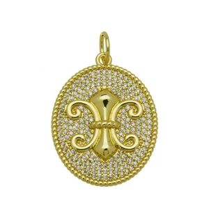 Detailed view of round 18k gold plated fleur-de-lis pendant with pavé zirconia