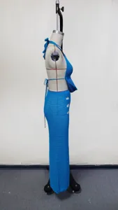 Side view detail of a blue crochet halter top and long skirt beach cover-up set for women.