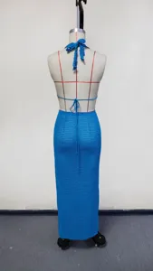 Knitted beach cover up set detail view, blue crochet halter top and long skirt back.