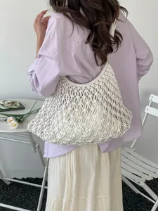 Elegant white hollow macramé woven tote bag for casual beach trips and daily commute fashion
