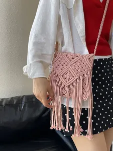 Handmade pink macrame phone bag with boho fringe and woven shoulder strap for summer travel