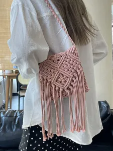 Stylish handmade pink macrame crossbody bag with long tassels for summer vacation