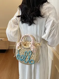 Stylish woven straw bucket bag with blue hello rope embroidery and floral handle scarf