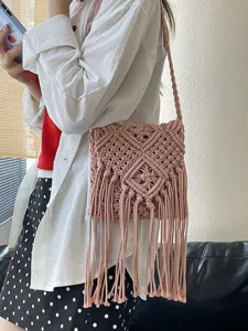 Pink handmade macramé woven shoulder bag with long bohemian fringe tassels for summer vacation