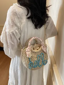 Summer straw bucket bag with blue hello embroidery and floral scarf handle