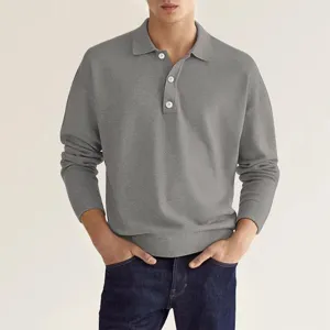 Grijs gebreid poloshirt met lange mouwen kraagdetail met fijne textuur en mooie knopen.